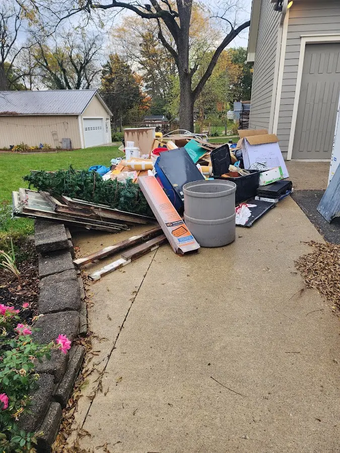 Dumpster being loaded with debris for Commercial Dumpster Rental in Fairfield